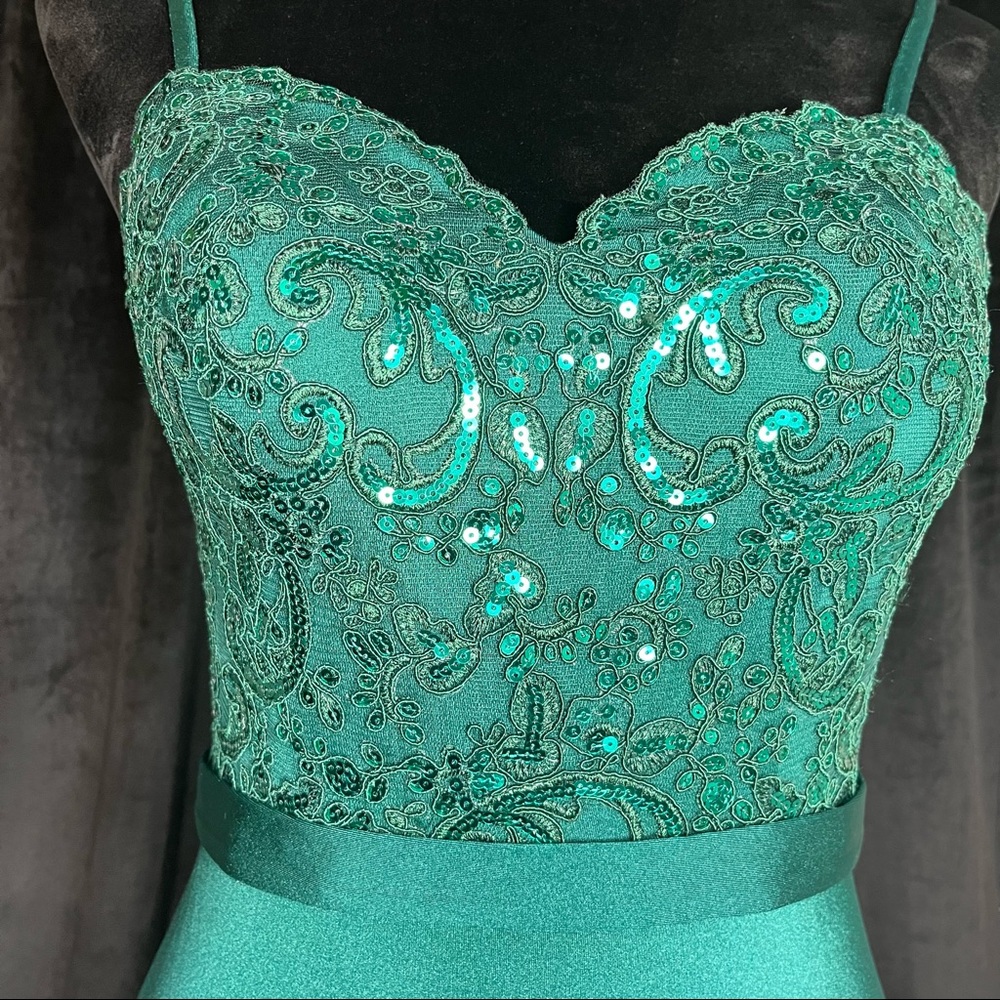 Emerald green long dress with a long mesh train